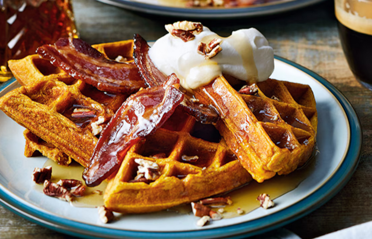 Squash waffles topped with candied bacon and whippe cream with pecansç
